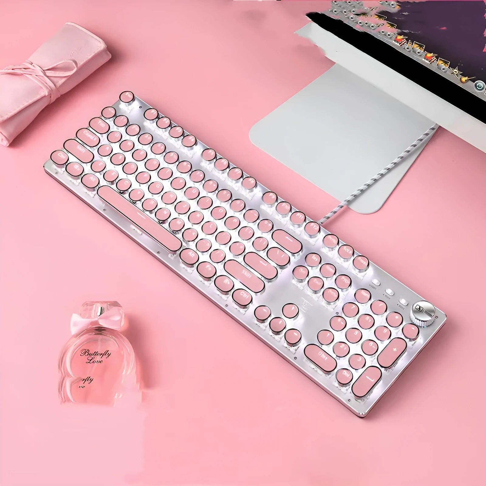 Silver and pink mechanical keyboard with green switches and white backlighting