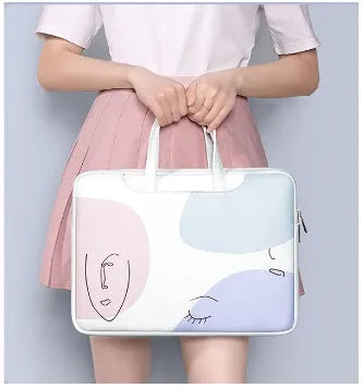 Blue PU leather laptop bag for girls with a soft handle and zip, shown with a 15.6-inch laptop.