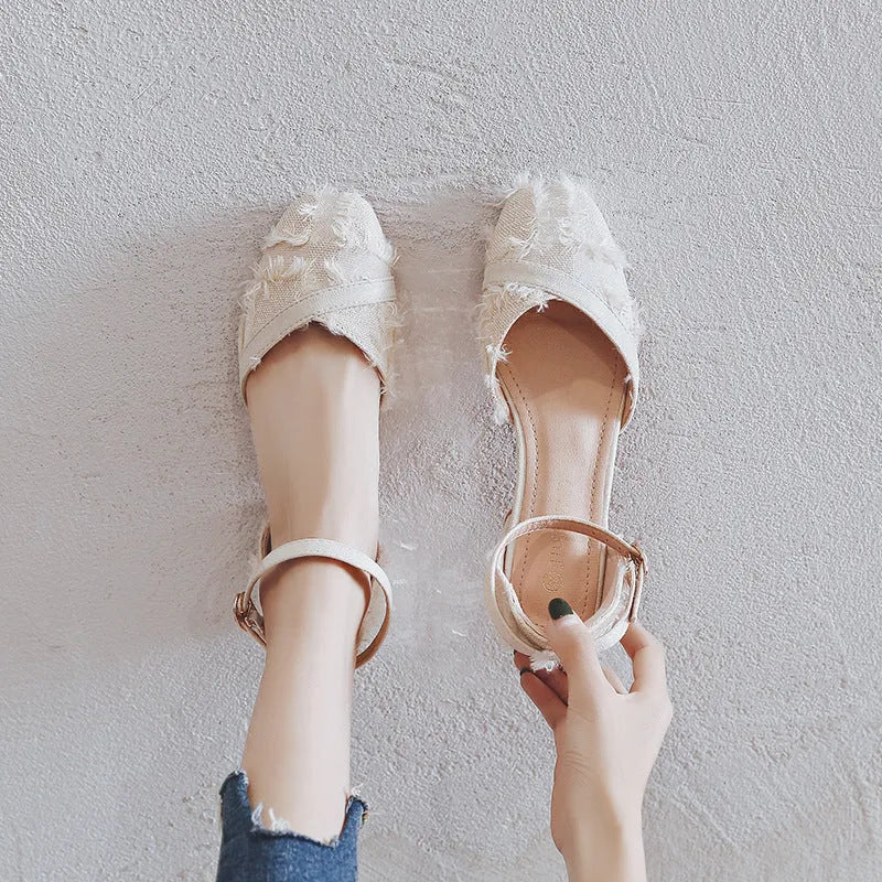 Women's apricot suede D'Orsay flats with ankle strap and low rubber sole.