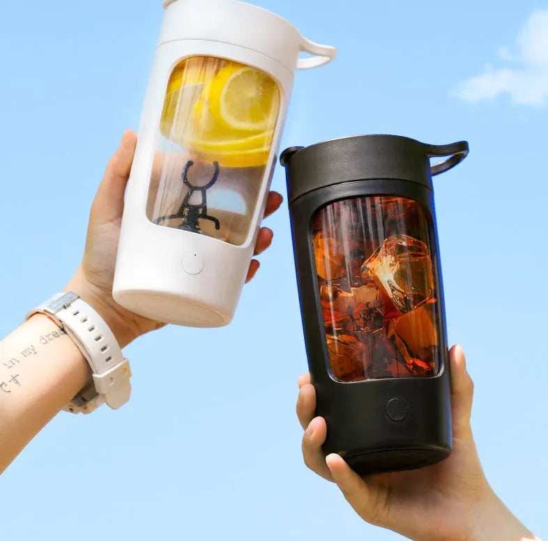Portable automatic mixing blender cup in black, blue, pink, or white, showing compact size