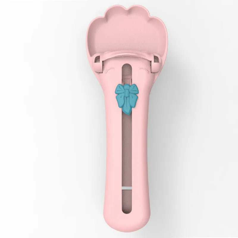 Green and pink plastic pet feed spoon with squeezer dispenser for liquid food and treats