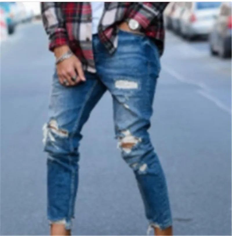 Men's deep blue cotton jeans with distressed hole details on the legs