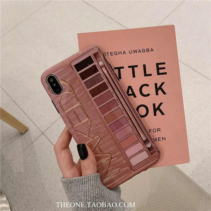 Flesh and grey silicone phone case for multiple iPhone models on a table.
