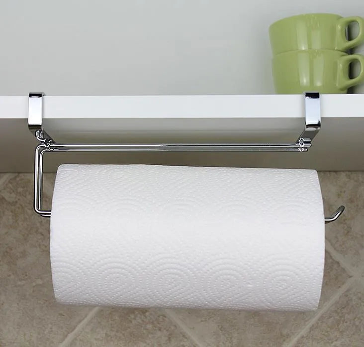 Silver stainless steel paper towel rack mounted on a kitchen cabinet door.