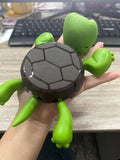 Turtle-shaped ABS plastic coaster for heat insulation in dark green, light green, wheat starch, and yellow colours.
