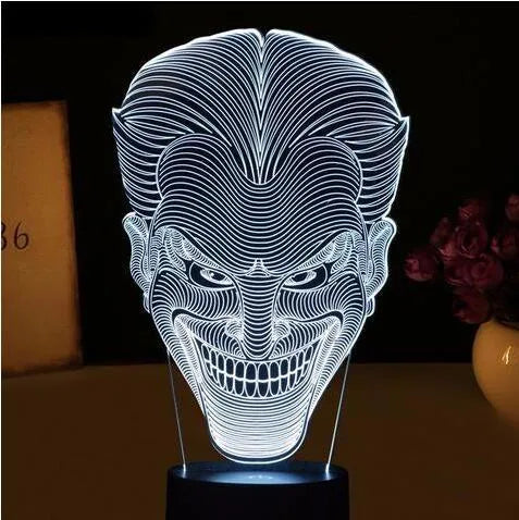 USB-powered 3D acrylic LED lamp showing multiple colour options on a desk