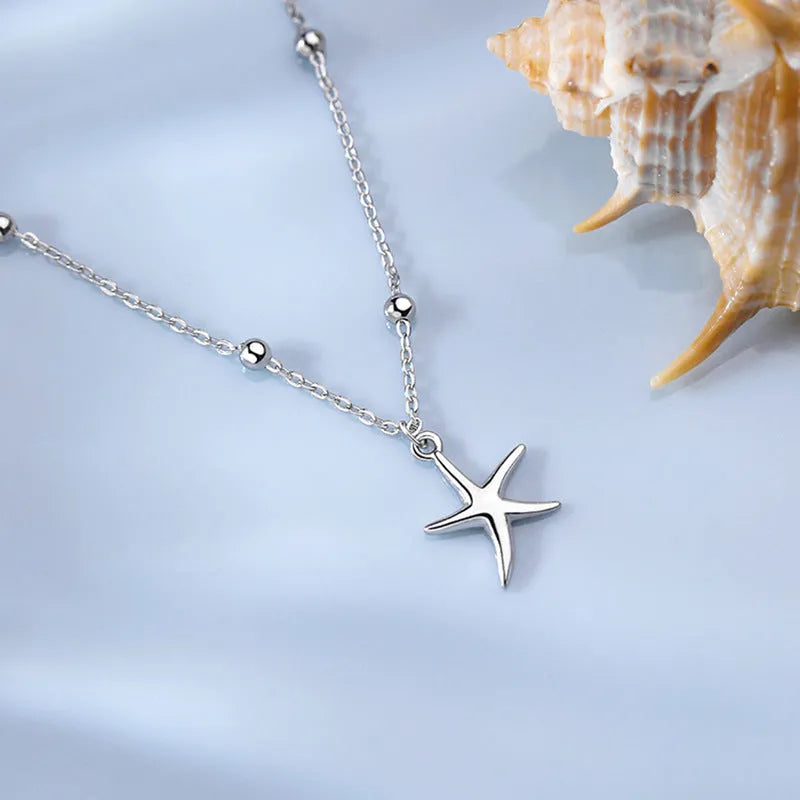 S925 sterling silver starfish anklet on an adjustable chain with round beads.