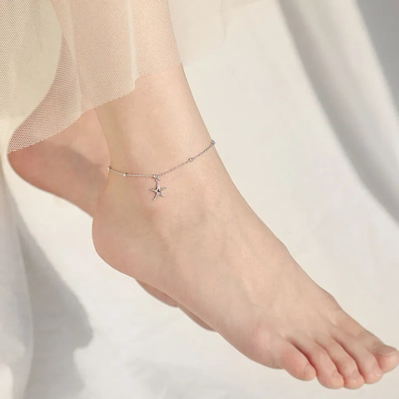 S925 sterling silver starfish anklet on an adjustable chain with round beads.
