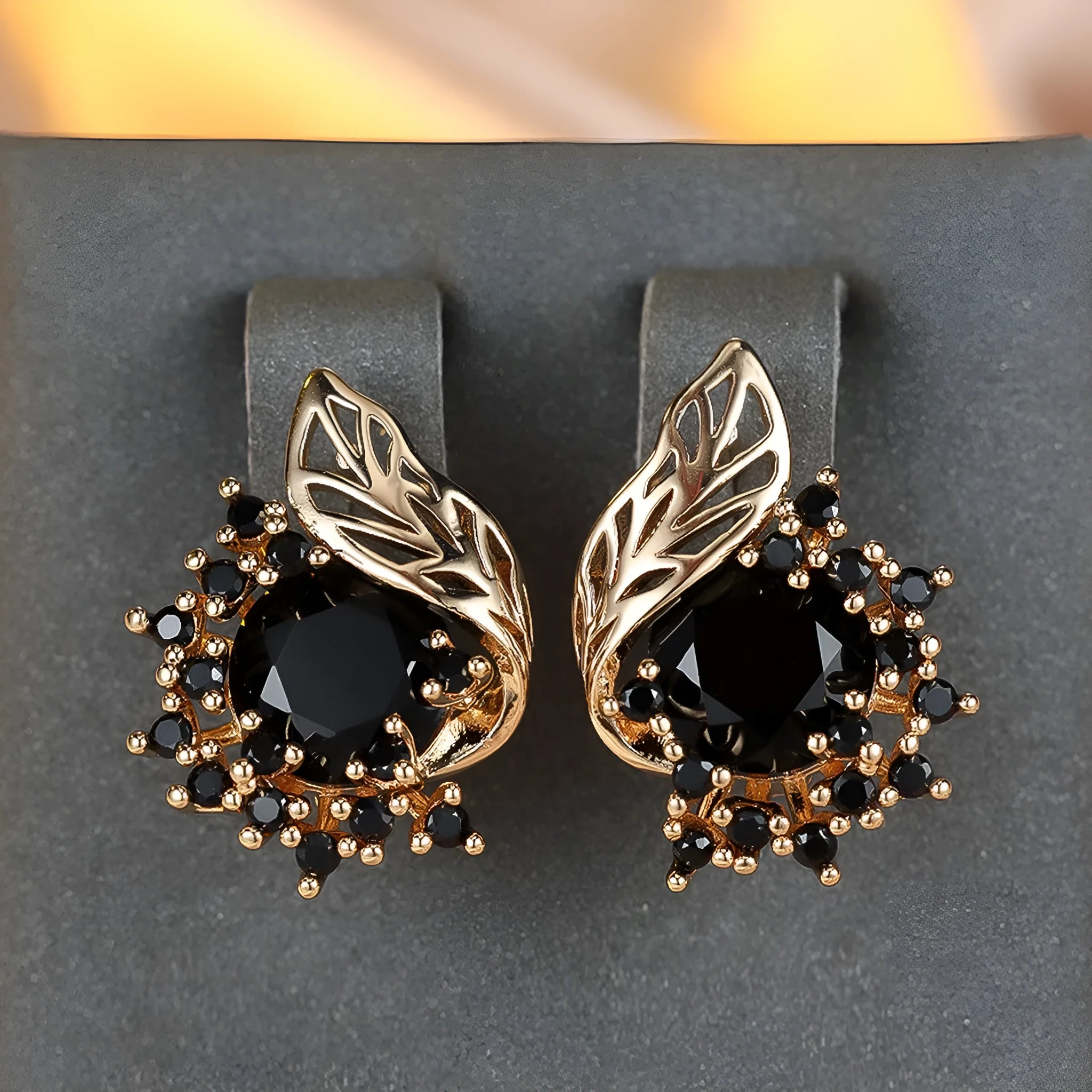 Rose gold coloured feather and flower design earrings with a choice of coloured zircon centre stones.