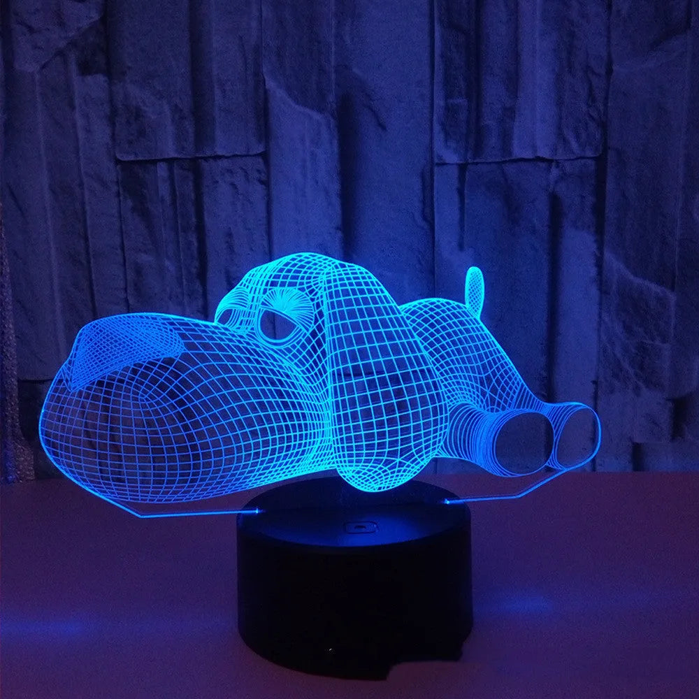 Glowing 3D illusion dog desktop night light showing multiple colour options on a desk.