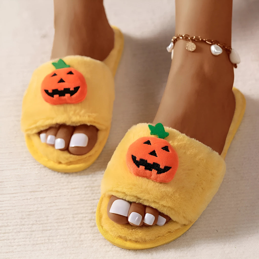 Halloween pumpkin plush slippers with open toe design in yellow colour showing synthetic fur and anti-slip soles