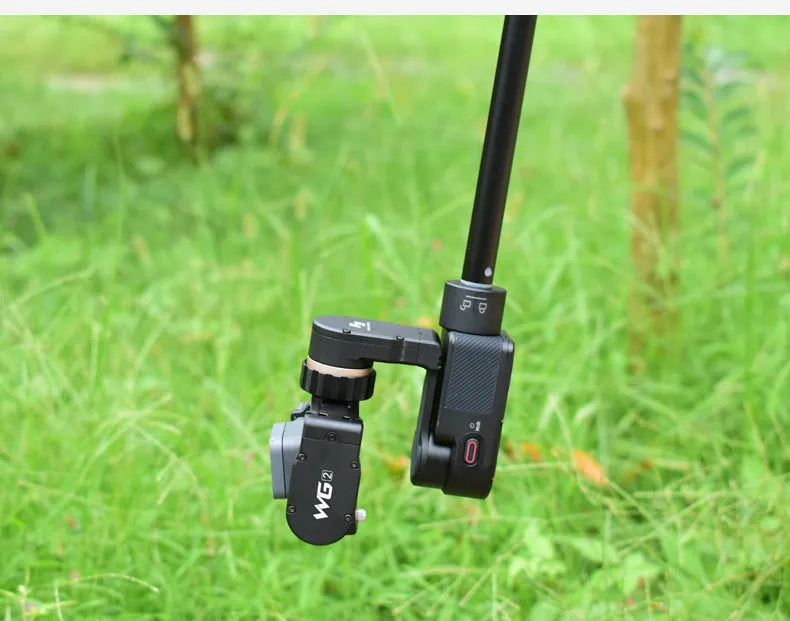 Black retractable extended selfie stick with smartphone clamp and adjustable tripod base