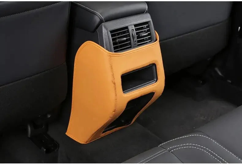 Set of three black leather anti-kick pads for 2023 Outlander seat and console protection.