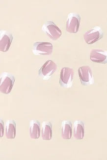 24 white acrylic nail tips with plaid pattern design arranged on display