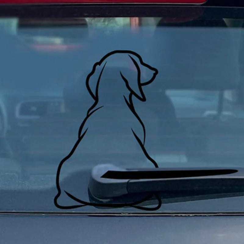 Cartoon dog car rear window sticker with wiper back design in black or white colours.