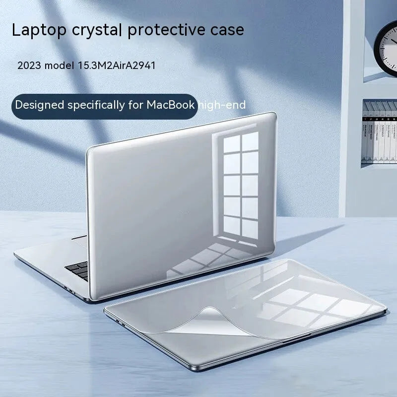 Transparent and frosted hard shell protective case fitted on a MacBook laptop.