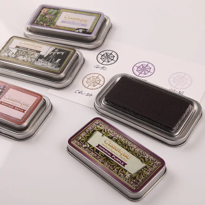 Rectangular oily stamp pad for rubber stamps in five colour options on craft table