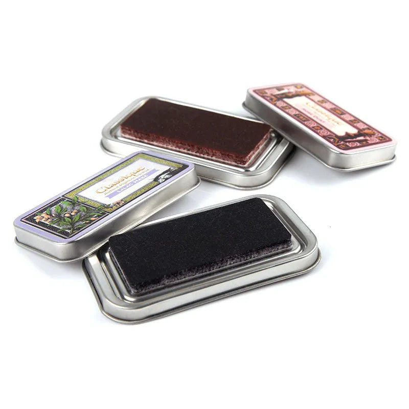 Rectangular oily stamp pad for rubber stamps in five colour options on craft table