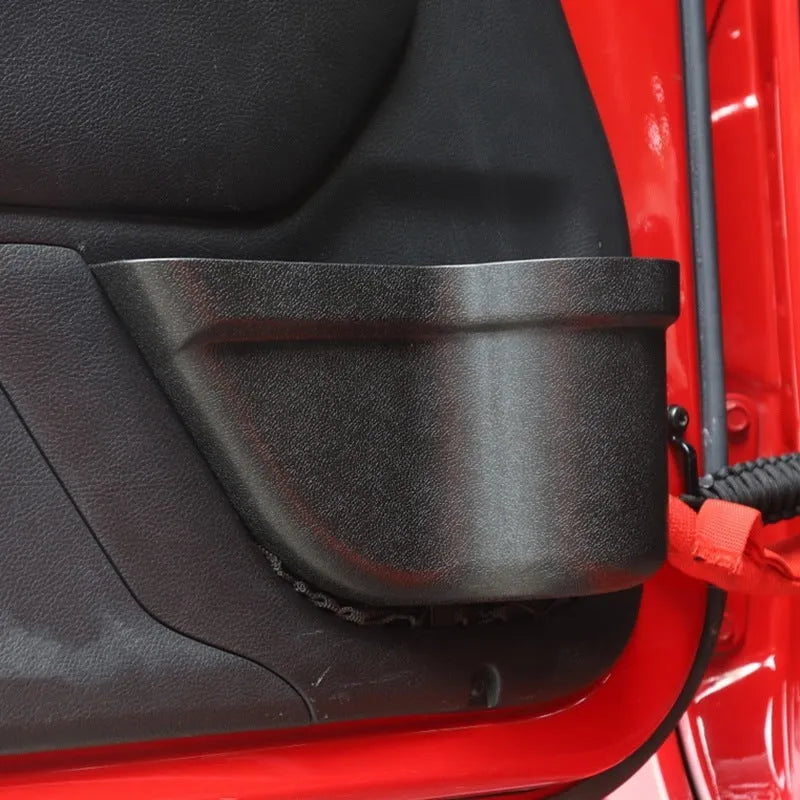 Black aluminium alloy car interior storage box with a net pocket for organising sunglasses and phones.