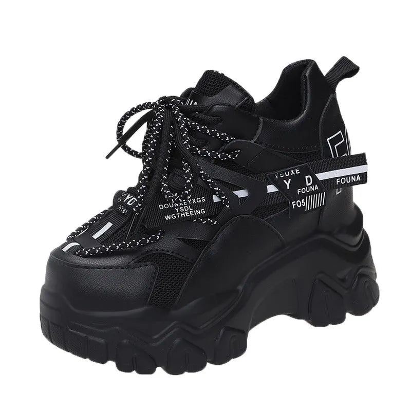 Women's white breathable mesh platform sports shoe with a cross strap on a rubber sole