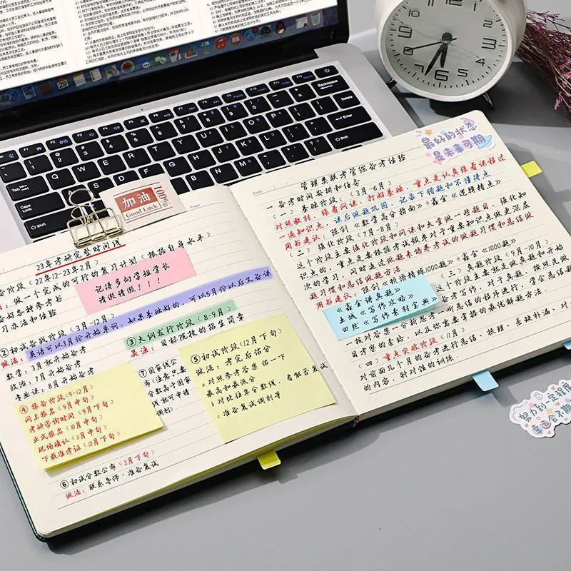 A5 square notebook with faux leather cover showing colour options and open blank pages