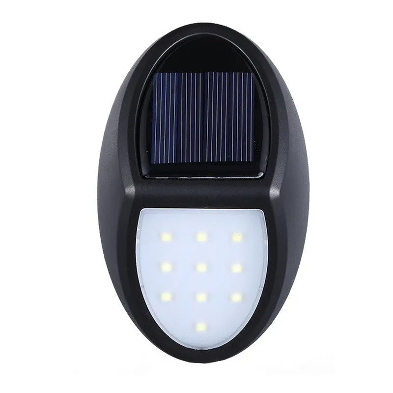 Black solar-powered LED wall light with automatic light sensor for outdoor garden use