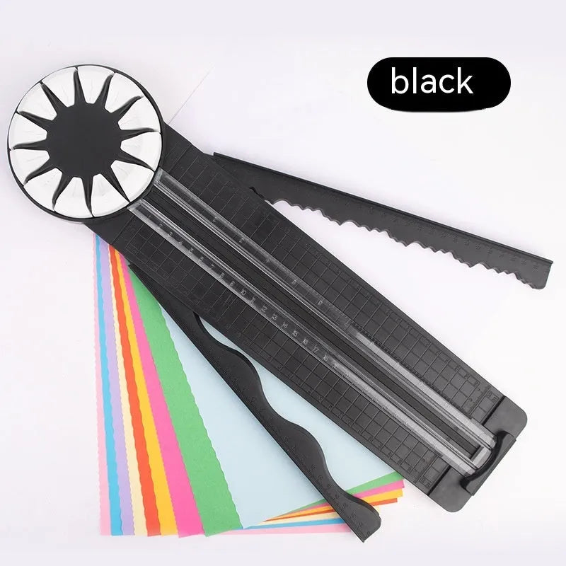 Pink 12-in-1 paper cutting machine with interchangeable blades for scrapbooking on white background