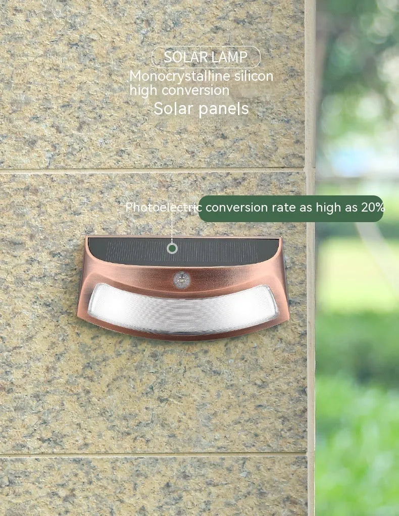 Solar-powered outdoor wall lamp with smiling face design for garden courtyard lighting