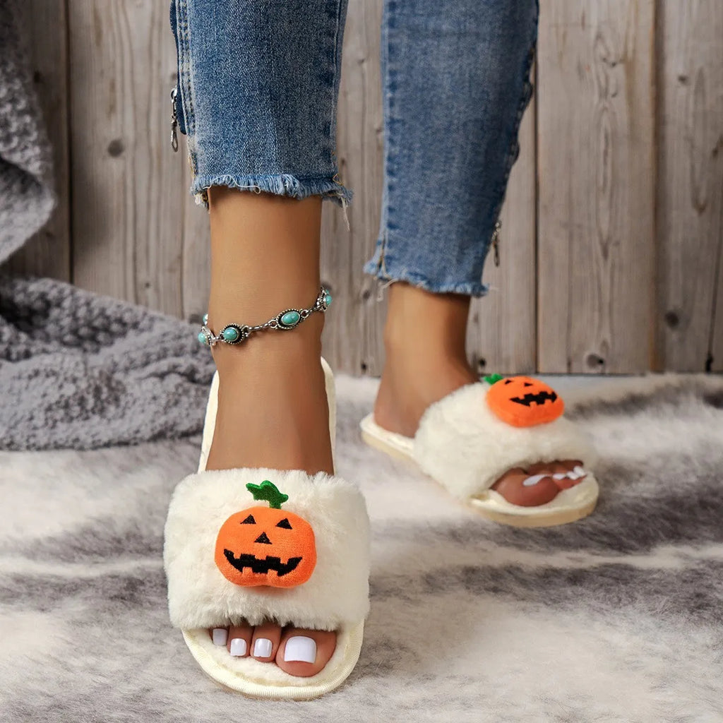 Halloween pumpkin plush slippers with open toe design in yellow colour showing synthetic fur and anti-slip soles