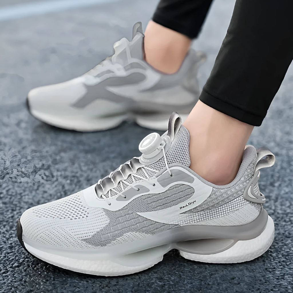 Men's white Korean-style running shoes with a rotating buckle closure and mesh upper.