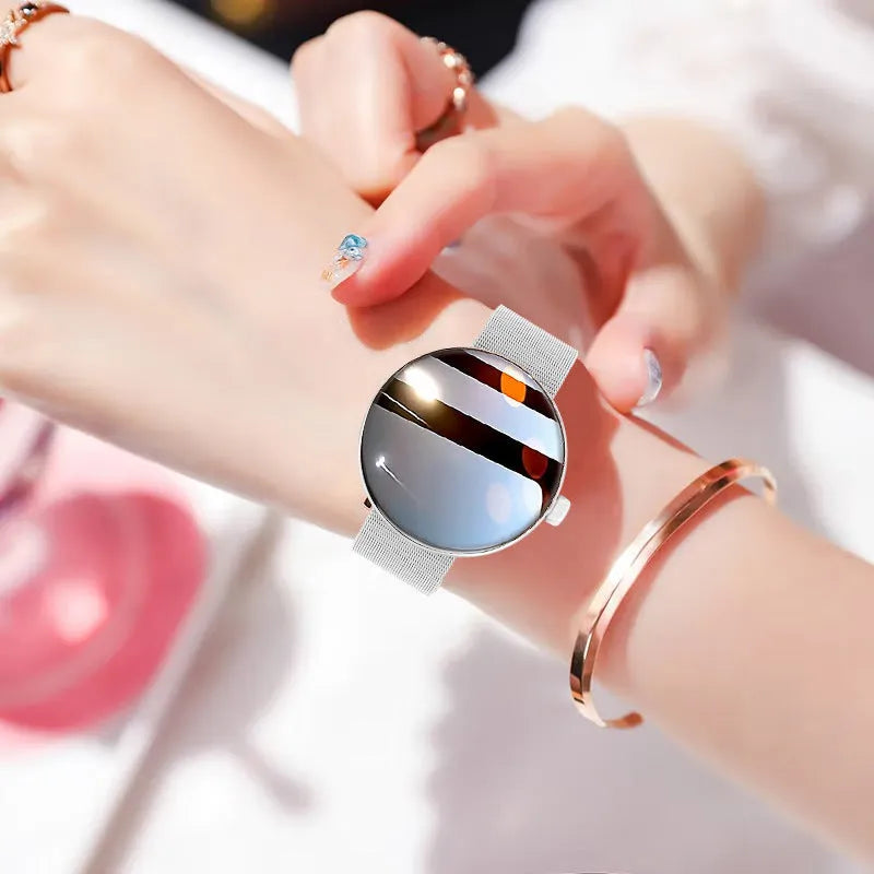 Smart watch for women with round colour screen and metal strap.