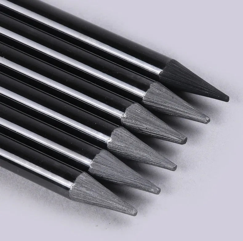 Set of nine wooden drawing pencils with six graphite and three carbonized pencils on suction card packaging