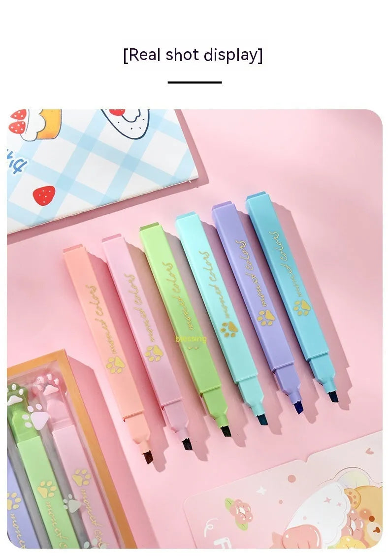 Box of six fluorescent marking pens with plastic shells and oblique nibs in assorted colours.