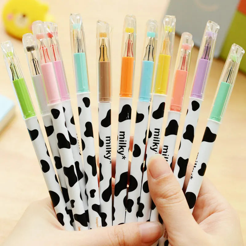 Box of twelve cow pattern gel pens with 0.38mm tips in assorted colours.