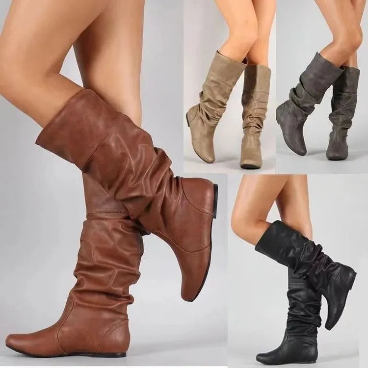 Women's black slip-on ankle boots with flat heel and round toe design