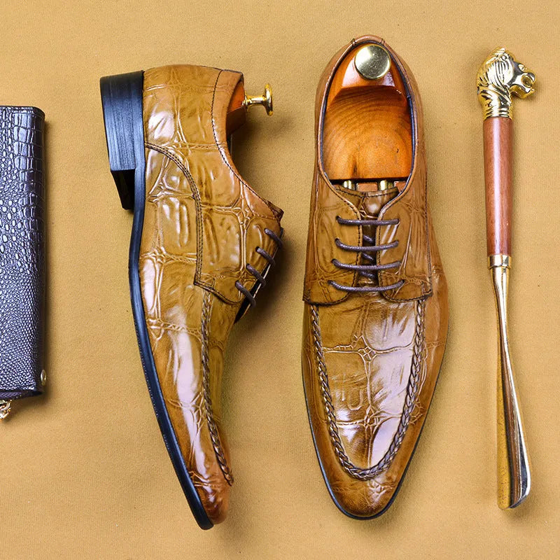 Men's black and brown leather shoes with alligator pattern texture and horse bit buckle detail
