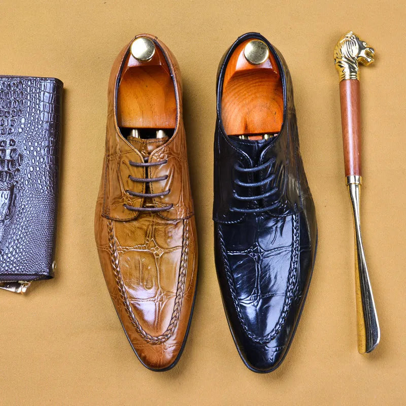 Men's black and brown leather shoes with alligator pattern texture and horse bit buckle detail