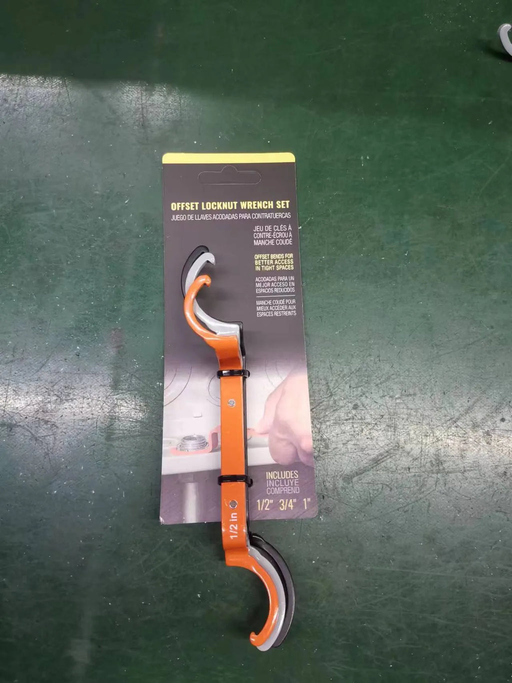 Three crescent wrenches with magnetic suction and catheter locking in orange, grey, and black colours