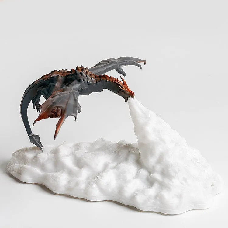 3D printed red dragon night light with USB charging cable on a dark surface