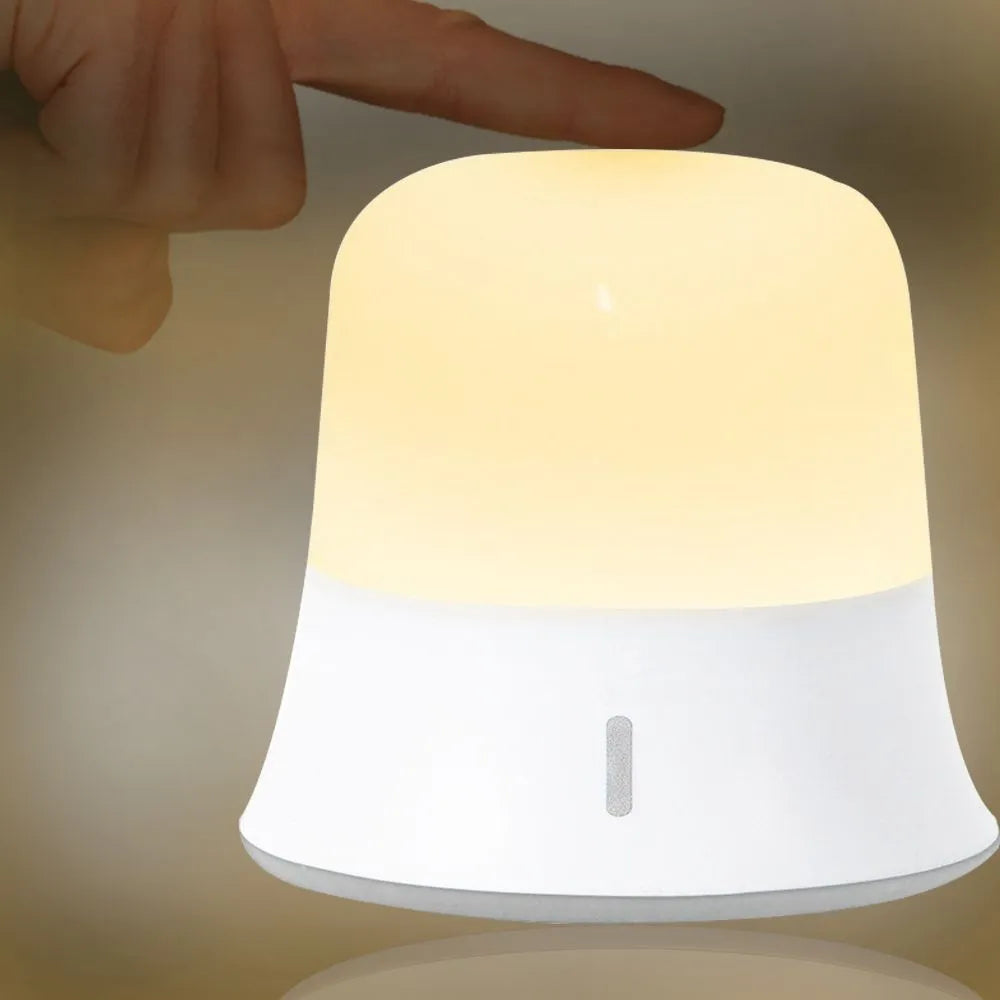 White bedside touch night light showing dimming control and colour change features