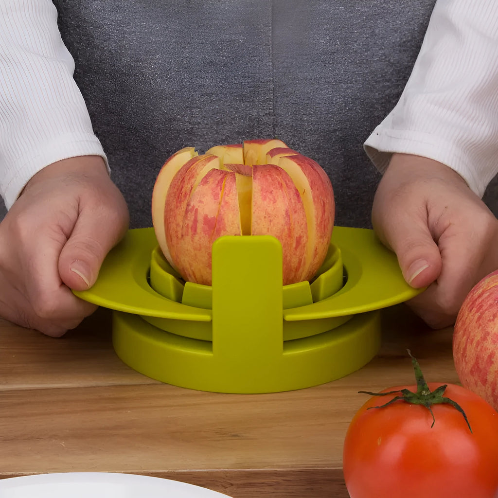 Green kitchen fruit slicer set with apple, tomato, and mango cutters on a stable base
