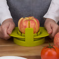 Green kitchen fruit slicer set with apple, tomato, and mango cutters on a stable base