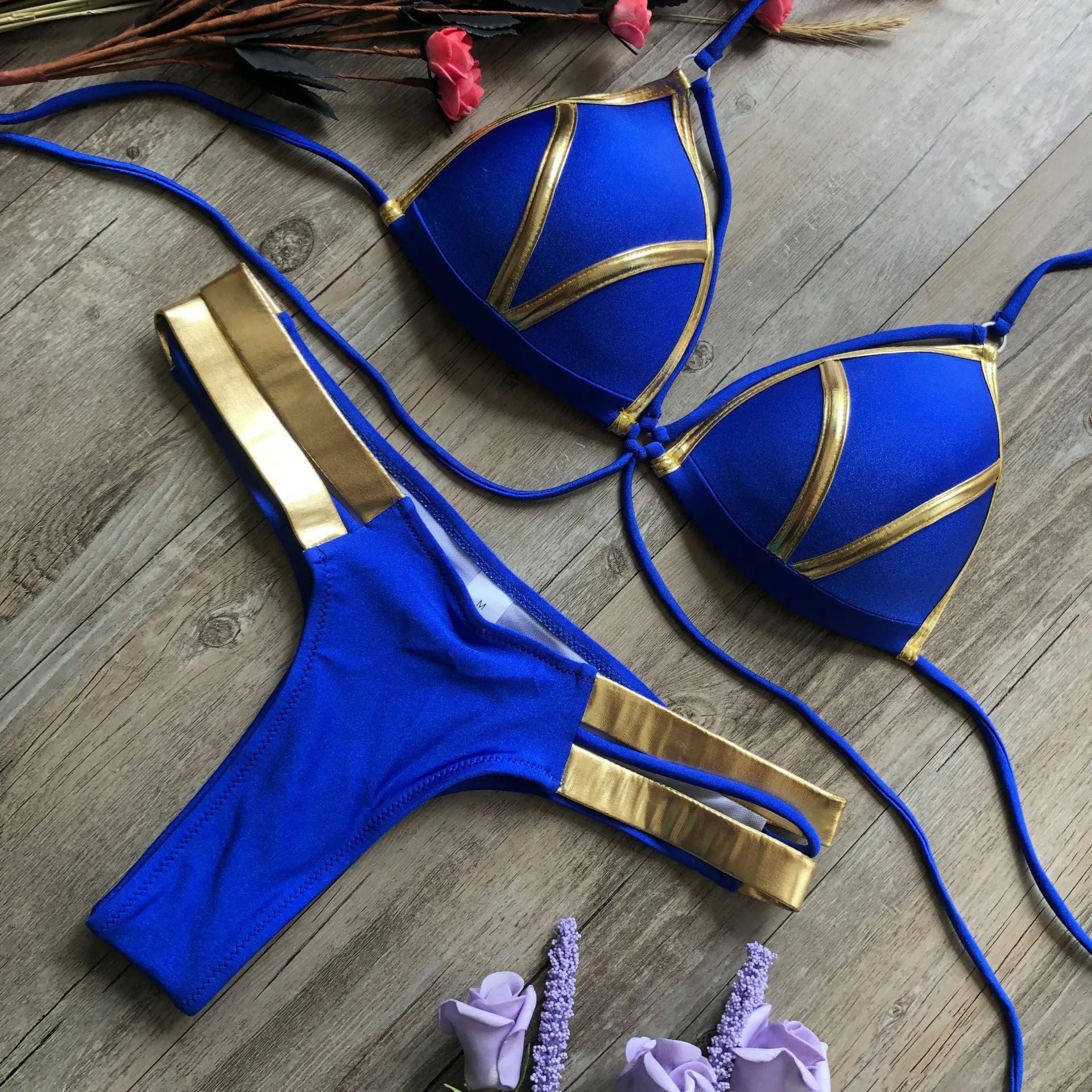 Women's nylon bikini set with removable pads in various colours including leopard print.
