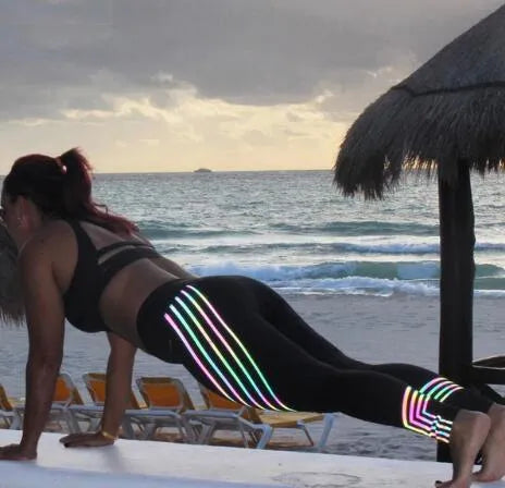 Women's black and white glowing print fitness leggings in milk silk fabric showing slim fit design