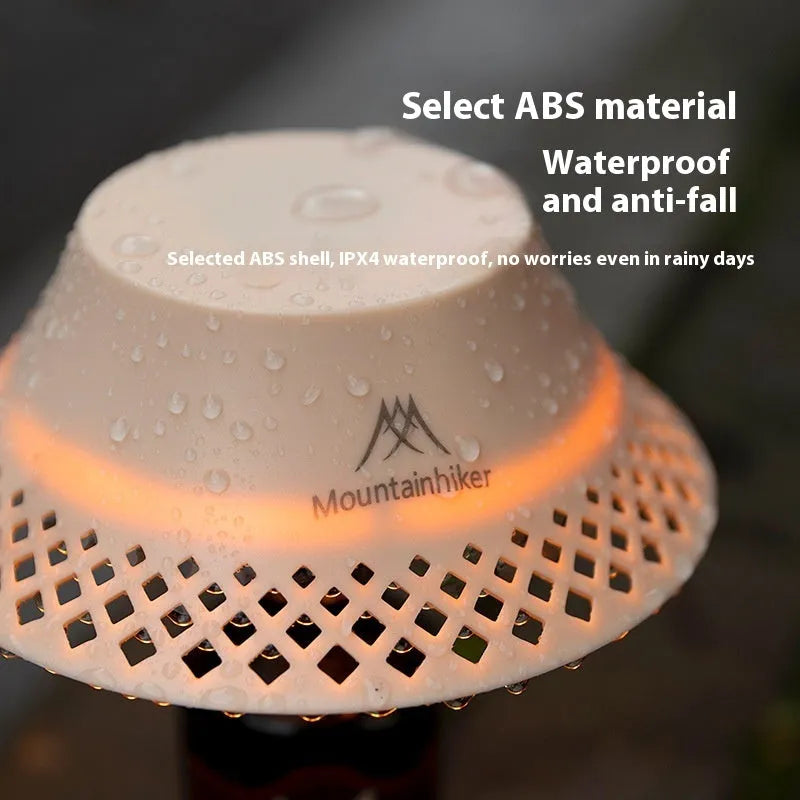 Beige wine bottle-shaped rechargeable camping lantern showing its size and USB-C port.