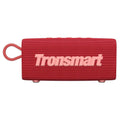 Portable waterproof Bluetooth speaker in multiple colour options on a outdoor surface.
