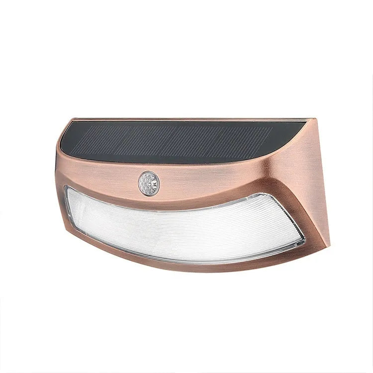 Solar-powered outdoor wall lamp with smiling face design for garden courtyard lighting