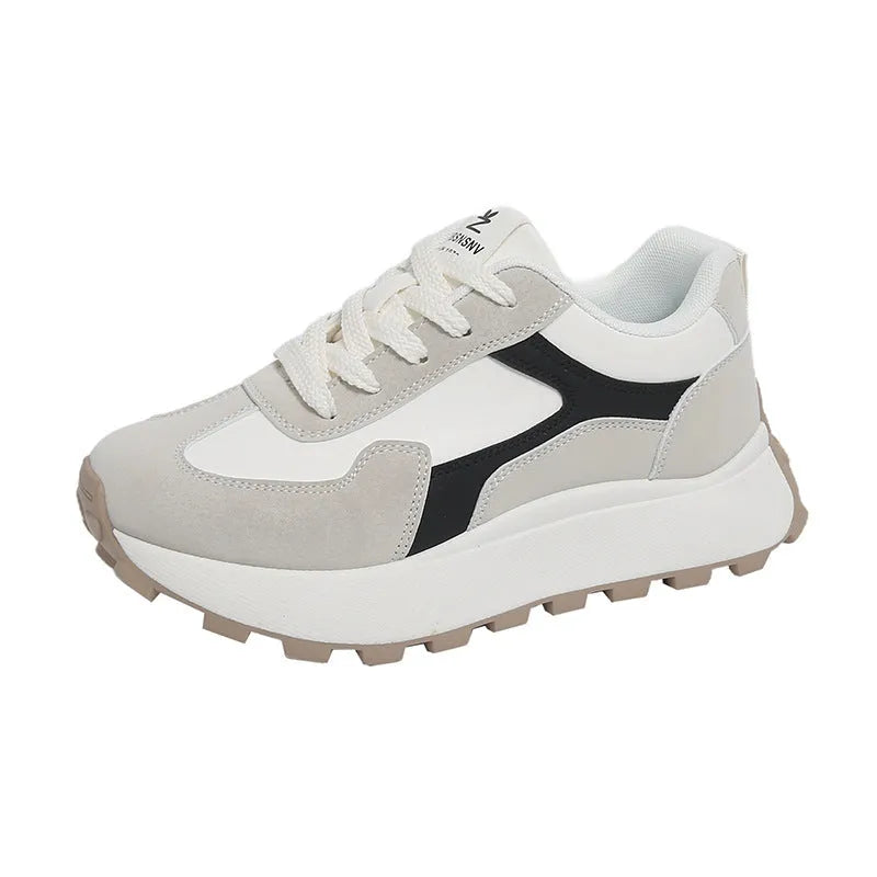 Women's low-top platform sports running shoes in solid colours with flat rubber sole and lace-up front.