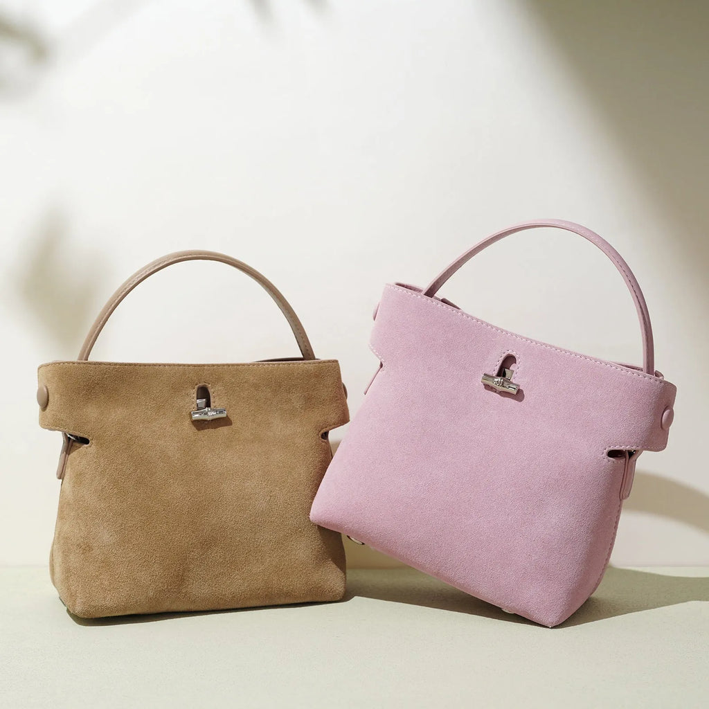 Women's mini messenger bag in matte cowhide with lock closure and bucket shape