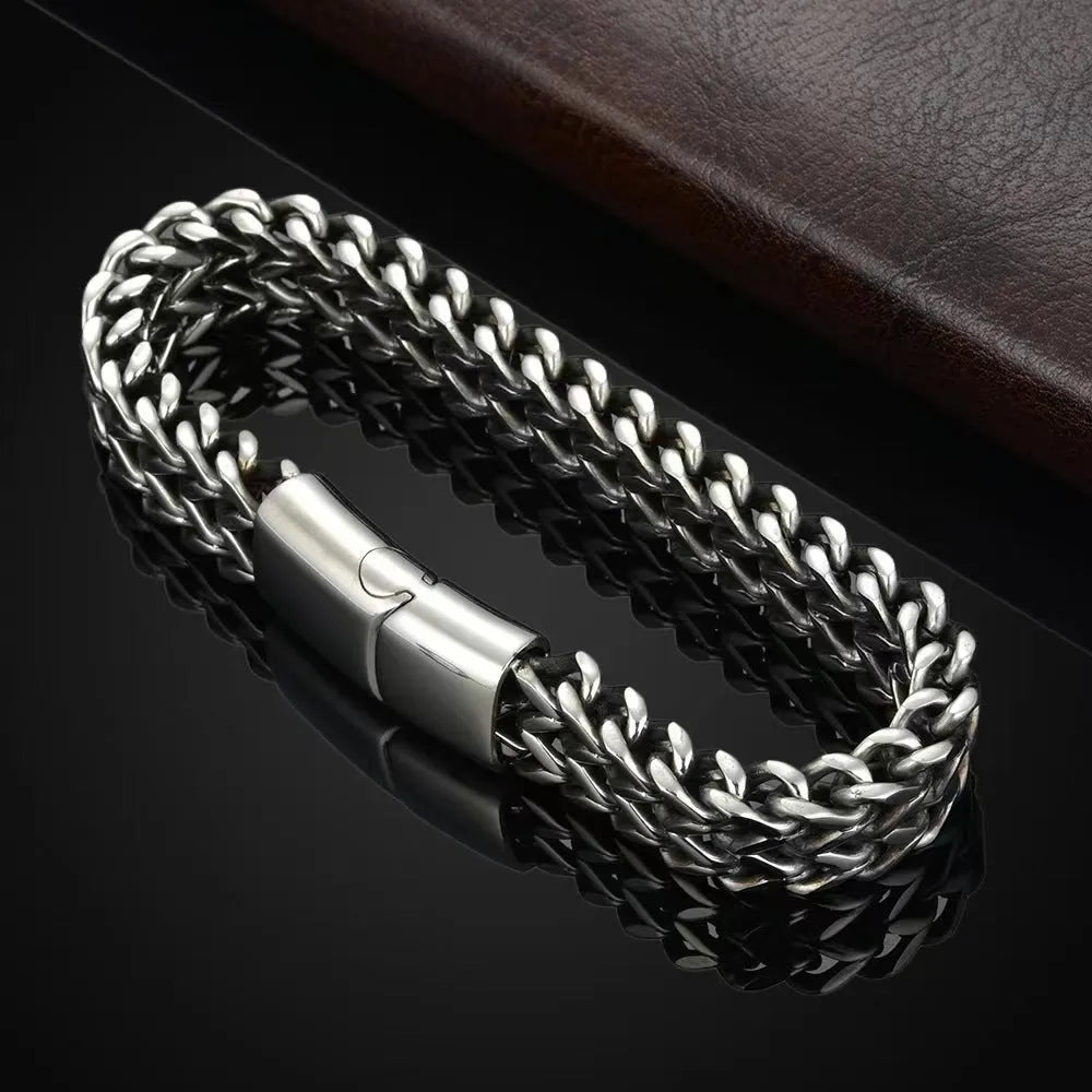 Silver titanium steel men's bracelet with geometric links on a wrist
